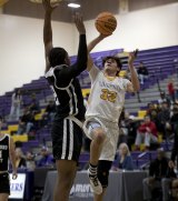 Lemoore's Aiden McDaniel looks to score against Hanford West.